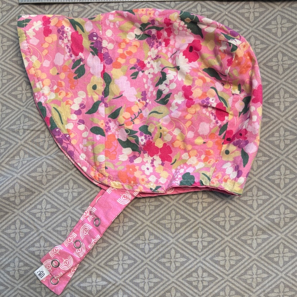 Urban baby bonnet reversible sun bonnet in pink floral.